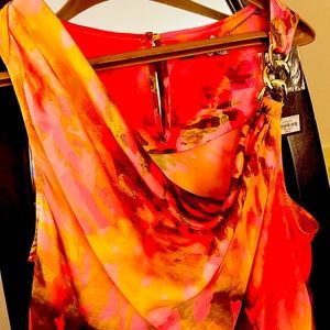 Jennifer Lopez, ( orange, pink, yellow)dress Gold chain on strap Medium